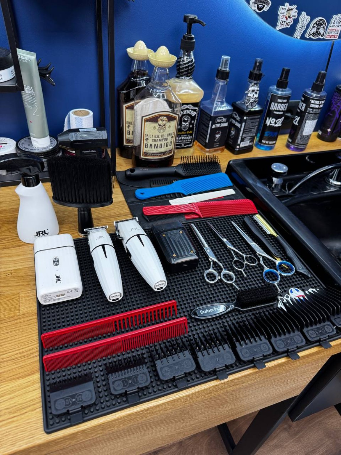 Clippers, scissors and combs ready for work