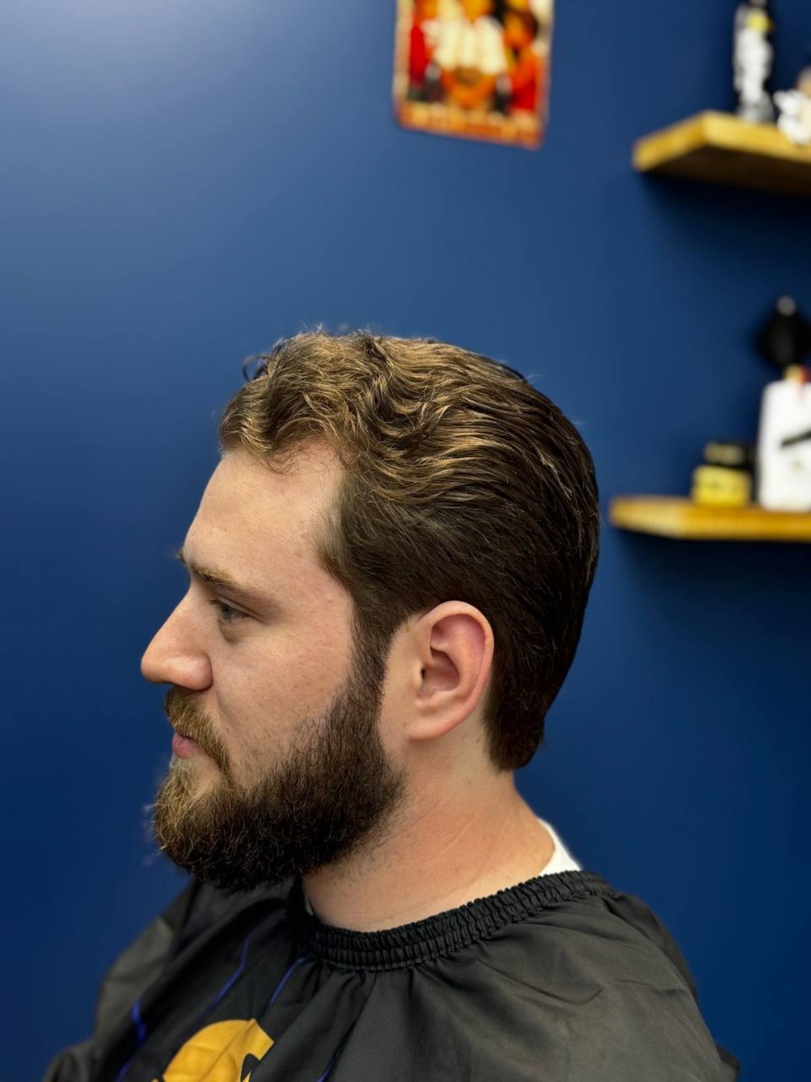 Styled haircut and beard after the service
